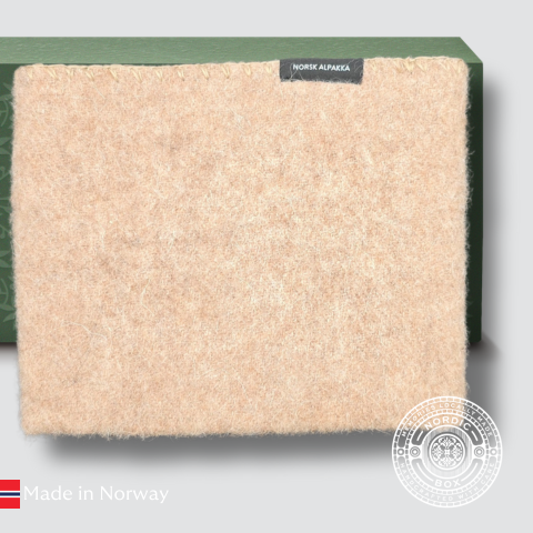 Beige sitteunderlag i alpakka