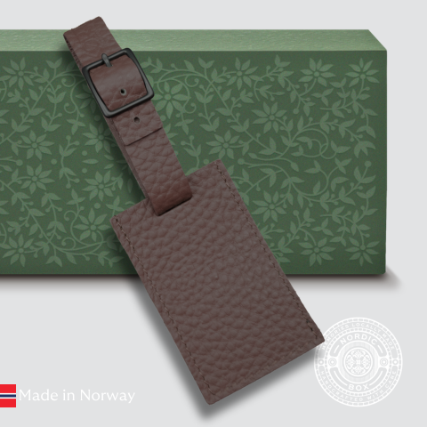 Gammel brun bagasjelapp i skinn